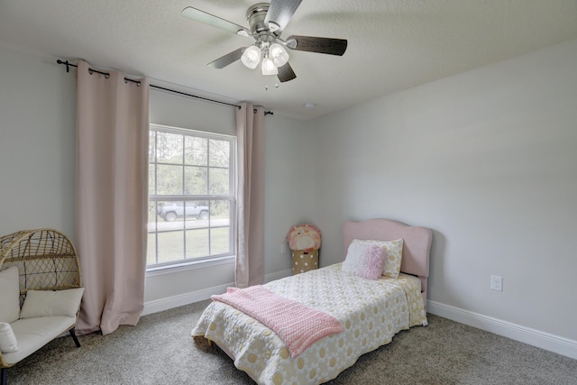 134 Day Dr, Sebastian, FL 32958 - bedroom featuring baseboards, ceiling fan, carpet flooring, and a textured ceiling