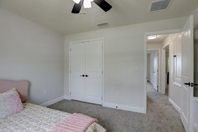 134 Day Dr, Sebastian, FL 32958 - carpeted bedroom featuring a ceiling fan, baseboards, a closet, and visible vents