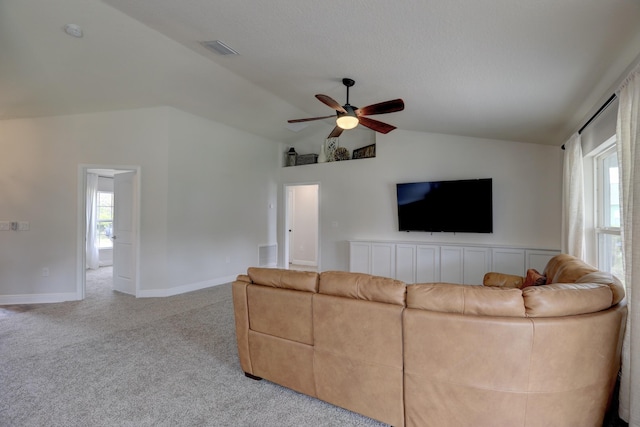 134 Day Dr, Sebastian, FL 32958 - unfurnished living room with lofted ceiling, carpet flooring, baseboards, visible vents, and ceiling fan
