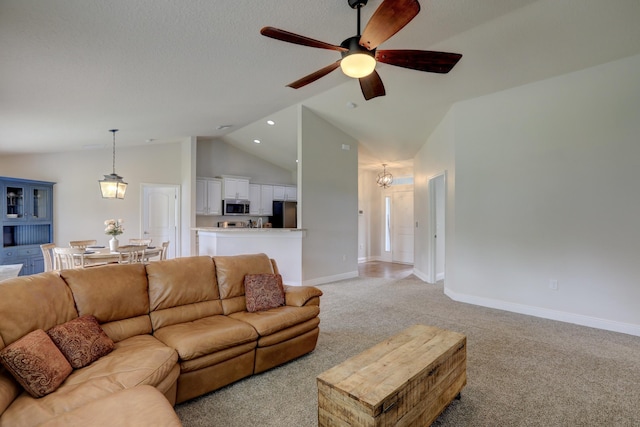 134 Day Dr, Sebastian, FL 32958 - living area featuring vaulted ceiling, baseboards, light colored carpet, ceiling fan, and recessed lighting