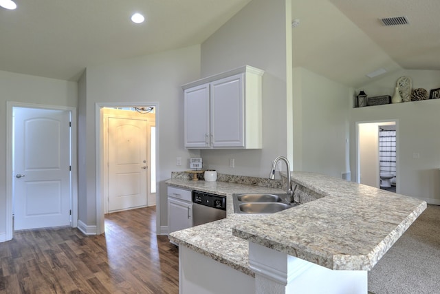 134 Day Dr, Sebastian, FL 32958 - kitchen with a sink, white cabinetry, dishwasher, a peninsula, and lofted ceiling
