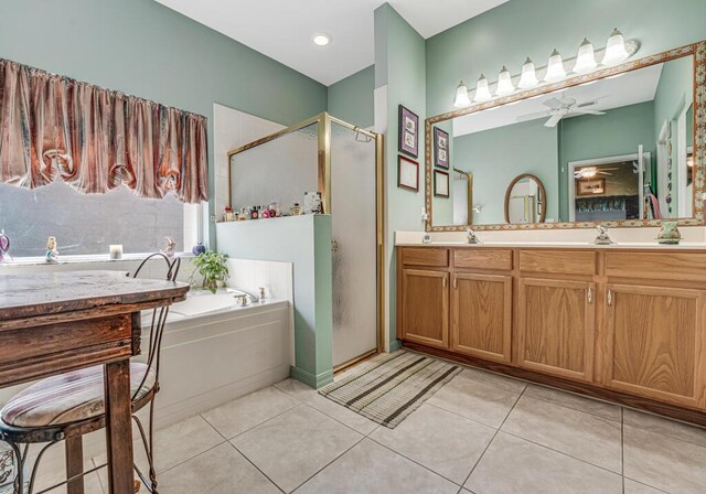 8328 Grand Messina Cir, Boynton Beach, FL 33472 - bathroom with a bath, double vanity, tile patterned floors, a ceiling fan, and a stall shower