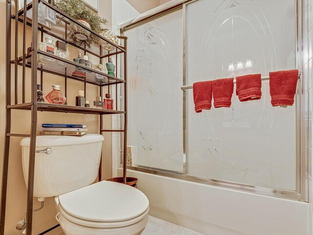 8328 Grand Messina Cir, Boynton Beach, FL 33472 - full bathroom with toilet, shower / bath combination with glass door, and tile patterned flooring