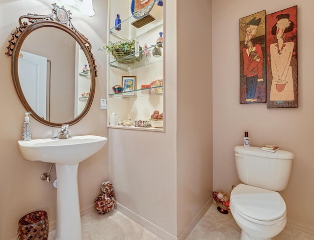 8328 Grand Messina Cir, Boynton Beach, FL 33472 - half bath with baseboards, toilet, and tile patterned flooring