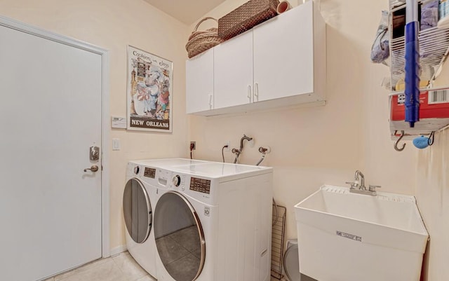 8328 Grand Messina Cir, Boynton Beach, FL 33472 - laundry room with cabinet space, a sink, independent washer and dryer, and light tile patterned floors