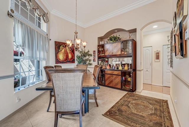 8328 Grand Messina Cir, Boynton Beach, FL 33472 - dining space with light tile patterned floors, arched walkways, crown molding, and a notable chandelier