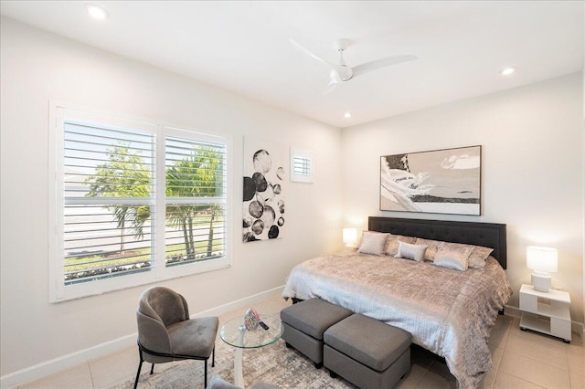 tiled bedroom with baseboards, ceiling fan, and recessed lighting