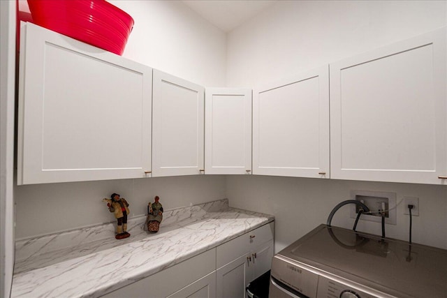 laundry area with washer / clothes dryer and cabinet space