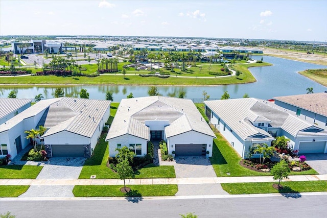 birds eye view of property featuring a water view and a residential view