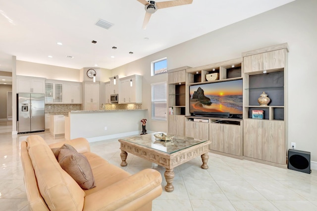 8318 Cameron Cave Dr, Boynton Beach, FL 33473 - living area featuring visible vents, light tile patterned floors, and a ceiling fan