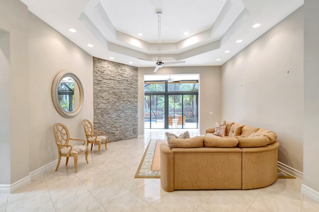 8318 Cameron Cave Dr, Boynton Beach, FL 33473 - living room featuring baseboards, a tray ceiling, and recessed lighting