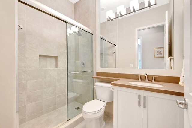 8318 Cameron Cave Dr, Boynton Beach, FL 33473 - bathroom featuring a stall shower, toilet, and vanity