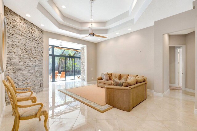 8318 Cameron Cave Dr, Boynton Beach, FL 33473 - living area featuring recessed lighting, a tray ceiling, baseboards, and ceiling fan
