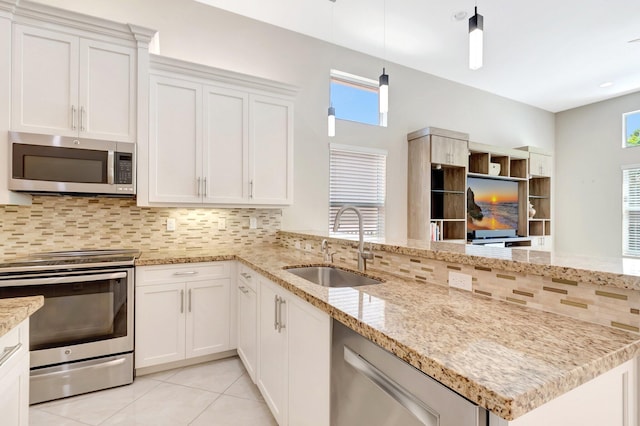8318 Cameron Cave Dr, Boynton Beach, FL 33473 - kitchen with light tile patterned flooring, a sink, stainless steel appliances, and tasteful backsplash