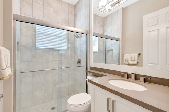 8318 Cameron Cave Dr, Boynton Beach, FL 33473 - bathroom featuring a shower stall, toilet, and vanity
