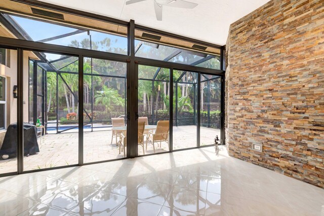 8318 Cameron Cave Dr, Boynton Beach, FL 33473 - empty room with ceiling fan, tile patterned floors, and a wall of windows