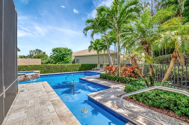 8318 Cameron Cave Dr, Boynton Beach, FL 33473 - view of swimming pool with a fenced backyard, a pool with connected hot tub, and a patio area