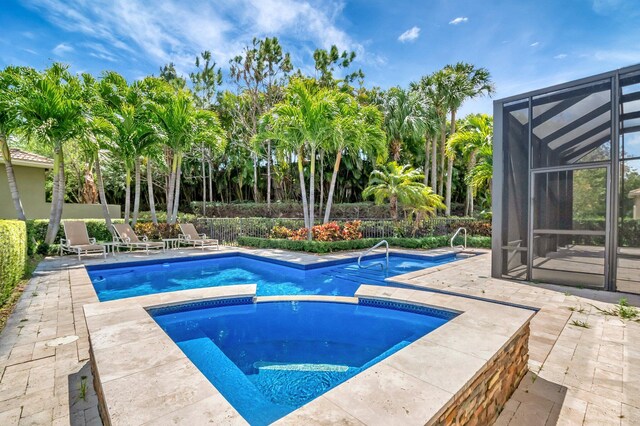 8318 Cameron Cave Dr, Boynton Beach, FL 33473 - view of pool featuring glass enclosure, a fenced in pool, fence, and a patio