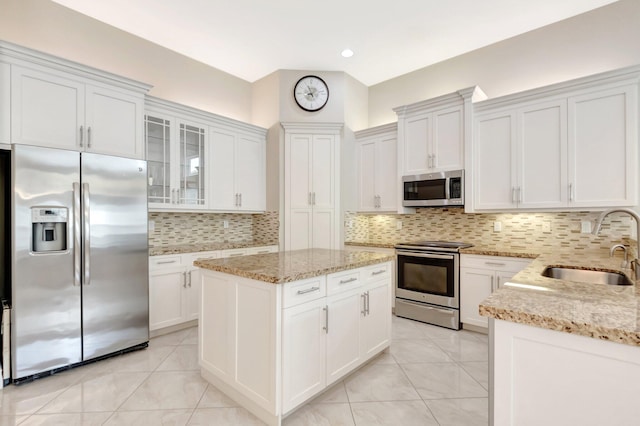 8318 Cameron Cave Dr, Boynton Beach, FL 33473 - kitchen featuring white cabinetry, a sink, stainless steel appliances, and light tile patterned floors