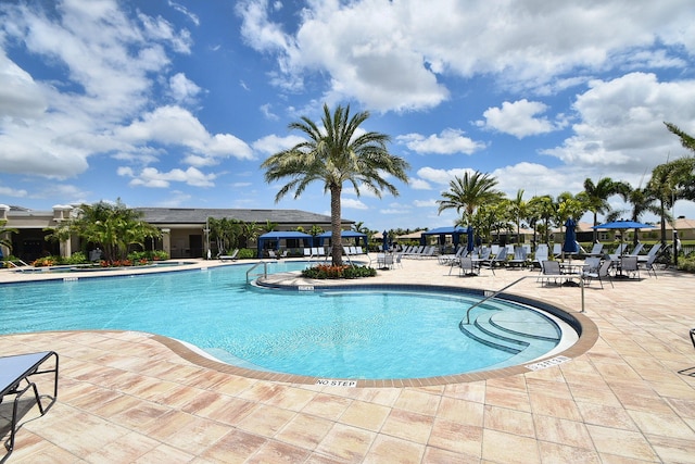 8318 Cameron Cave Dr, Boynton Beach, FL 33473 - community pool featuring a patio area