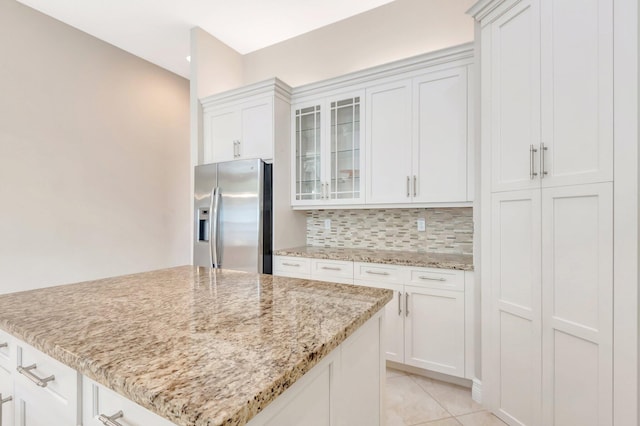 8318 Cameron Cave Dr, Boynton Beach, FL 33473 - kitchen with glass insert cabinets, white cabinetry, decorative backsplash, and stainless steel refrigerator with ice dispenser