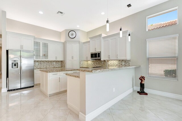 8318 Cameron Cave Dr, Boynton Beach, FL 33473 - kitchen with glass insert cabinets, visible vents, decorative backsplash, and stainless steel appliances