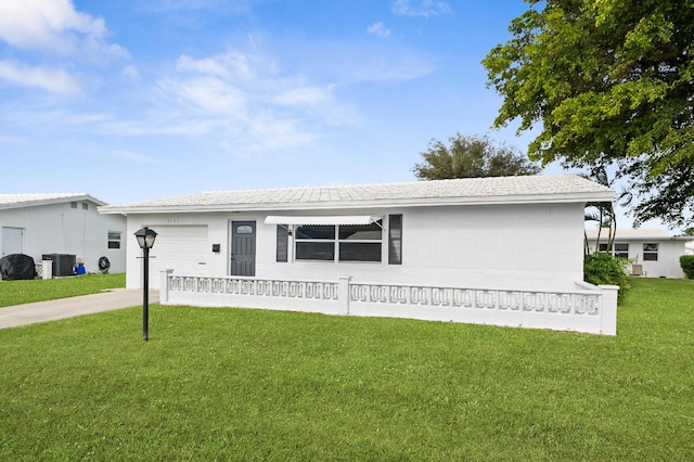 single story home featuring driveway, a garage, central AC unit, and a front yard