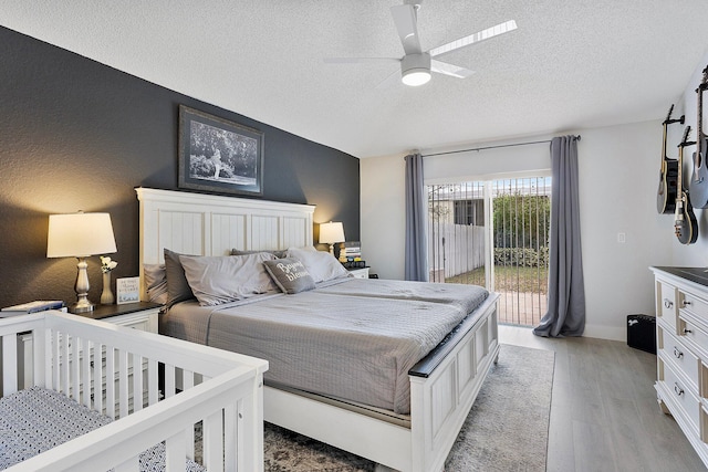 3773 NW 63rd Ct, Coconut Creek, FL 33073 - bedroom with access to outside, light wood-style floors, ceiling fan, and a textured ceiling