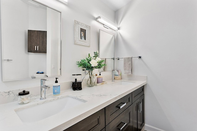 3773 NW 63rd Ct, Coconut Creek, FL 33073 - bathroom featuring double vanity, a sink, and baseboards
