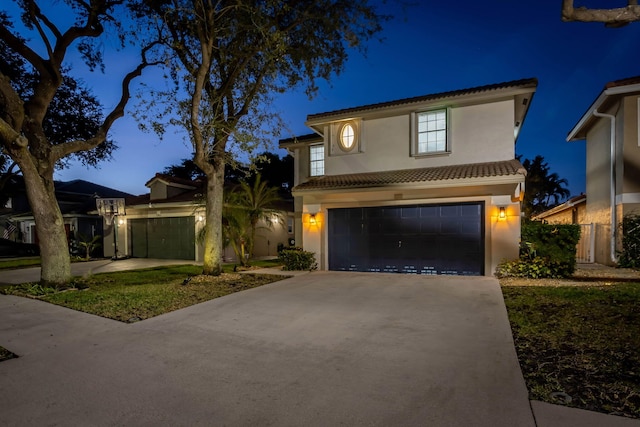 3773 NW 63rd Ct, Coconut Creek, FL 33073 - view of front of house featuring stucco siding, an attached garage, a tile roof, and concrete driveway