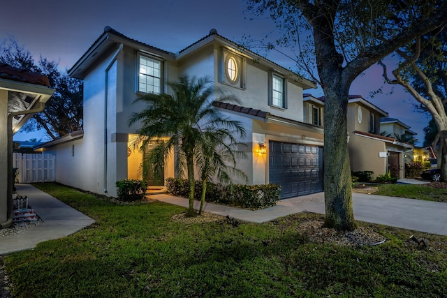 3773 NW 63rd Ct, Coconut Creek, FL 33073 - mediterranean / spanish home with stucco siding, fence, an attached garage, a tiled roof, and driveway