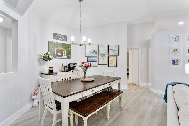 3773 NW 63rd Ct, Coconut Creek, FL 33073 - dining room with baseboards, light wood-style flooring, and an inviting chandelier