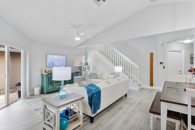 3773 NW 63rd Ct, Coconut Creek, FL 33073 - living area featuring vaulted ceiling, stairway, light wood-type flooring, visible vents, and ceiling fan