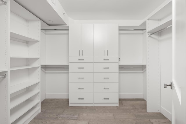 walk in closet featuring light wood-style floors