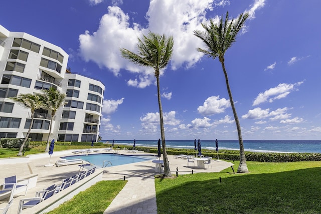 2575 S Ocean Blvd Unit 102S, Highland Beach, FL 33487 - community pool with a patio, a yard, and a water view
