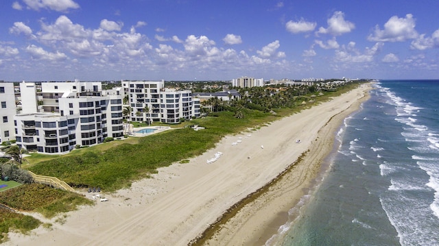 aerial view featuring a water view and a view of the beach