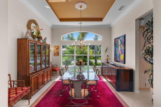 7406 Carmela Way, Delray Beach, FL 33446 - dining space with a tray ceiling, a chandelier, plenty of natural light, light tile patterned flooring, and ornamental molding