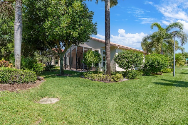 7406 Carmela Way, Delray Beach, FL 33446 - view of grassy yard with glass enclosure