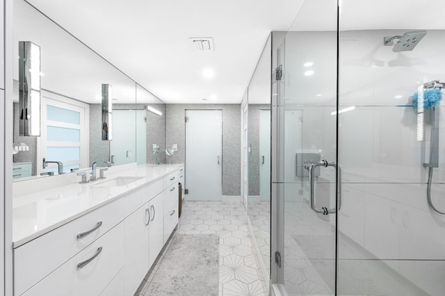 bathroom with a stall shower, vanity, recessed lighting, and tile patterned floors