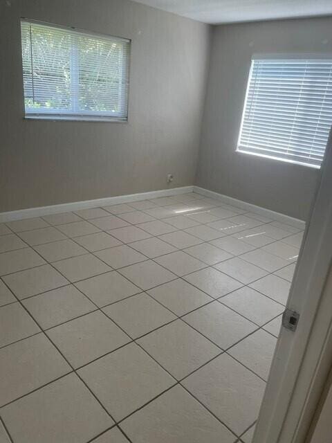 6881 Church St, Jupiter, FL 33458 - unfurnished room featuring baseboards and a healthy amount of sunlight