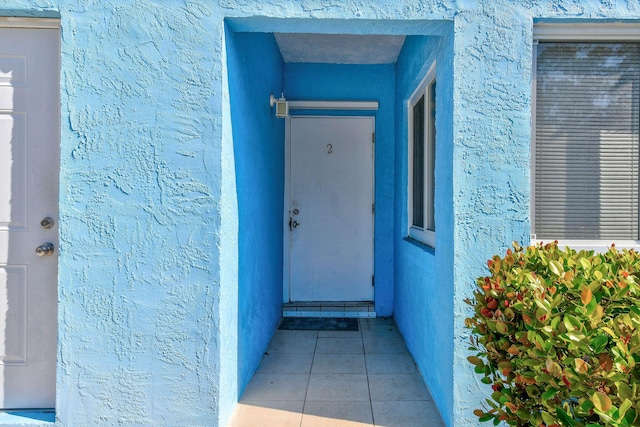 6881 Church St, Jupiter, FL 33458 - view of exterior entry featuring stucco siding