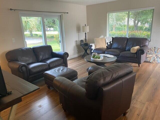 6881 Church St, Jupiter, FL 33458 - living room with baseboards and wood finished floors