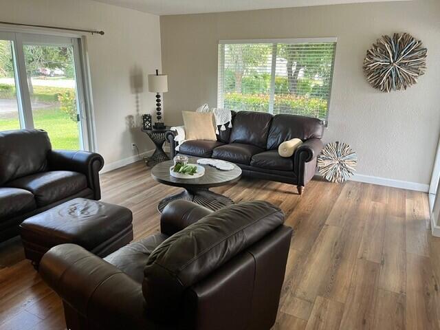 6881 Church St, Jupiter, FL 33458 - living room with baseboards and wood finished floors
