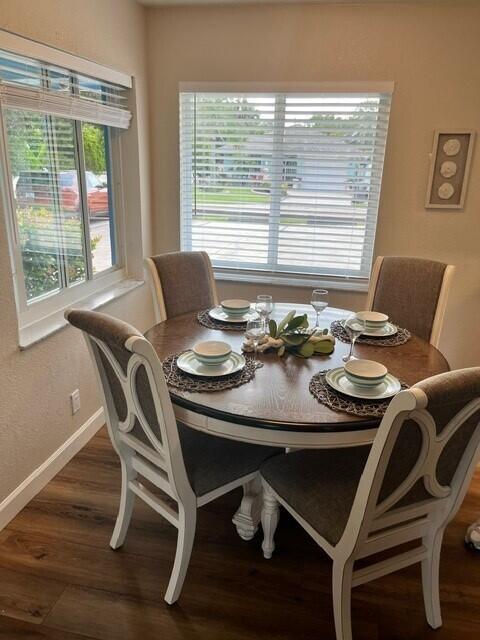 6881 Church St, Jupiter, FL 33458 - dining area featuring baseboards and wood finished floors