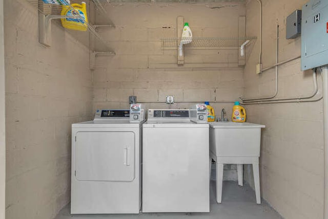 6881 Church St, Jupiter, FL 33458 - laundry room with a sink, concrete block wall, independent washer and dryer, and electric panel
