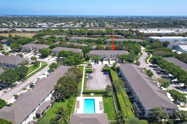 birds eye view of property with a residential view