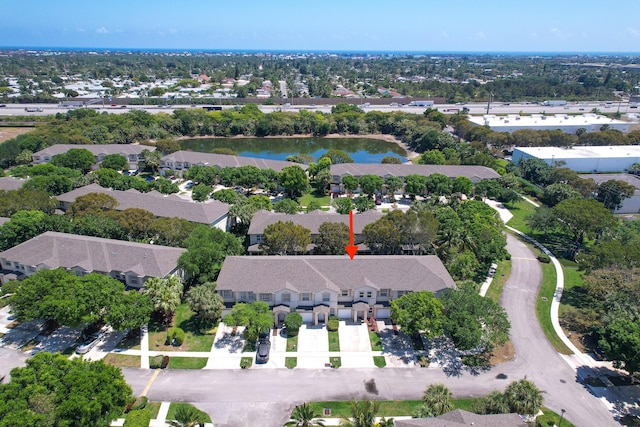 bird's eye view with a residential view and a water view