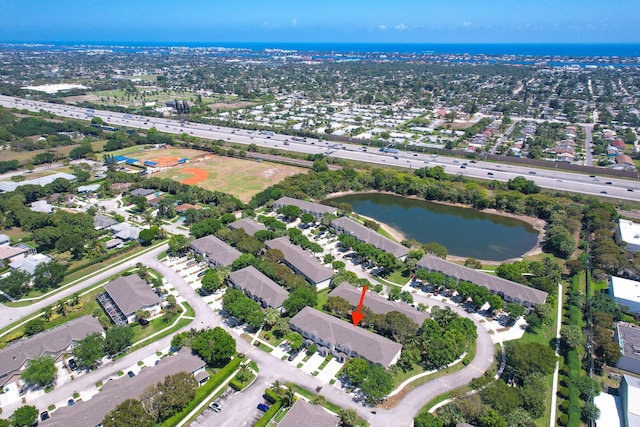 birds eye view of property featuring a residential view and a water view