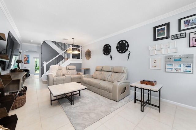 living room with crown molding, arched walkways, stairway, light tile patterned flooring, and baseboards