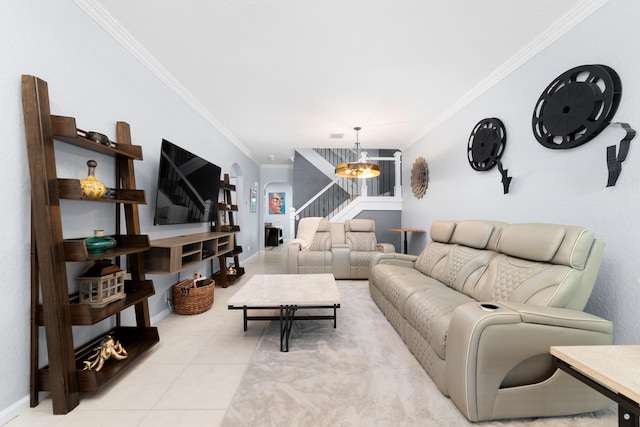 living area featuring an inviting chandelier, arched walkways, ornamental molding, stairway, and light tile patterned flooring